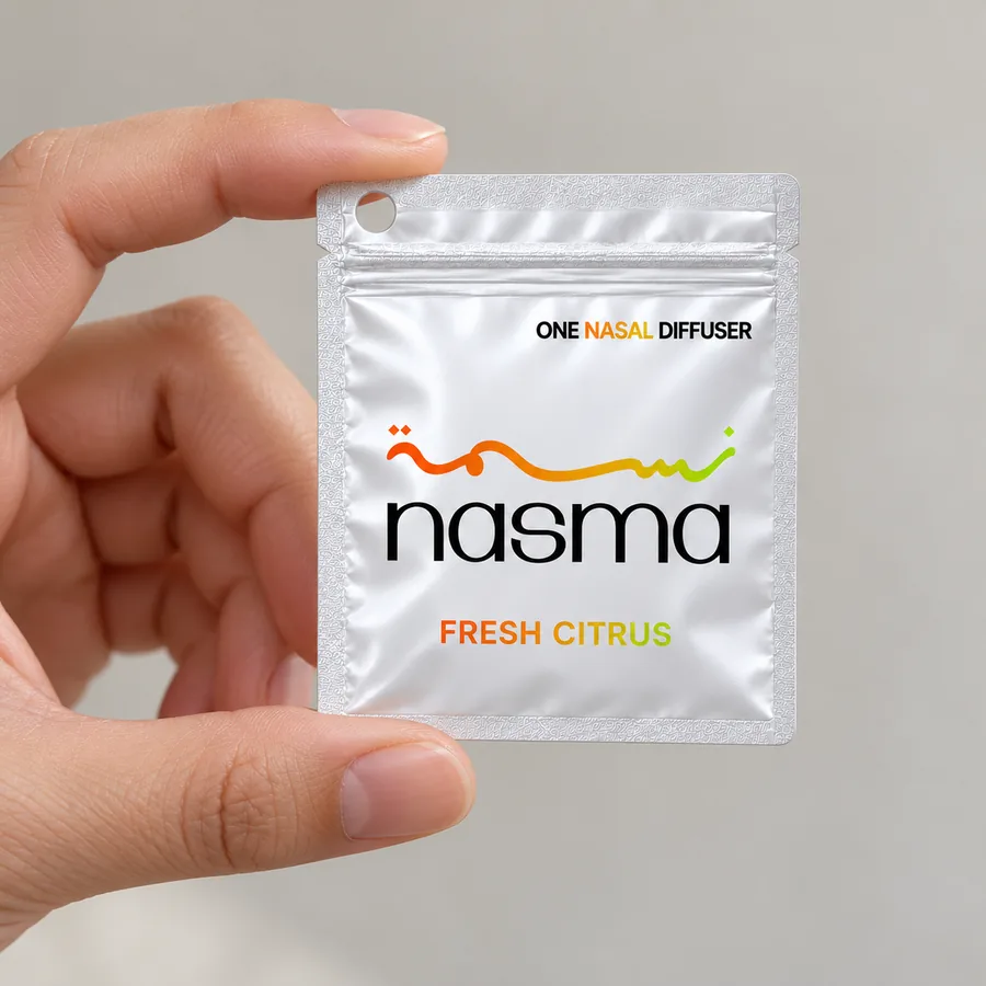 A Fresh Citrus pouch held between two fingers