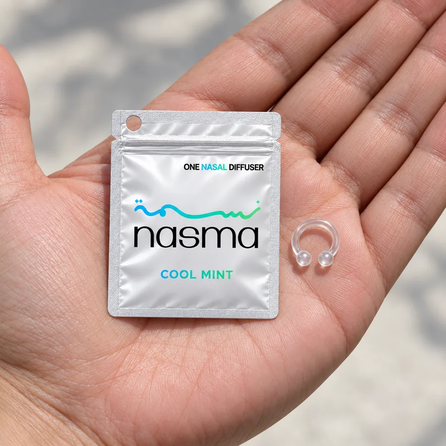 A Cool Mint pouch and the ring in an open palm